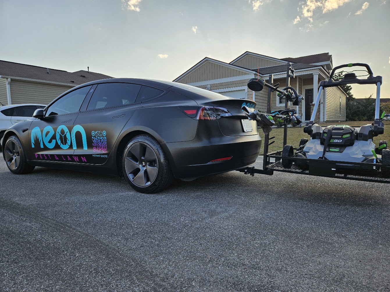 Neon's branded mowing equipment and trailer in Myrtle Beach