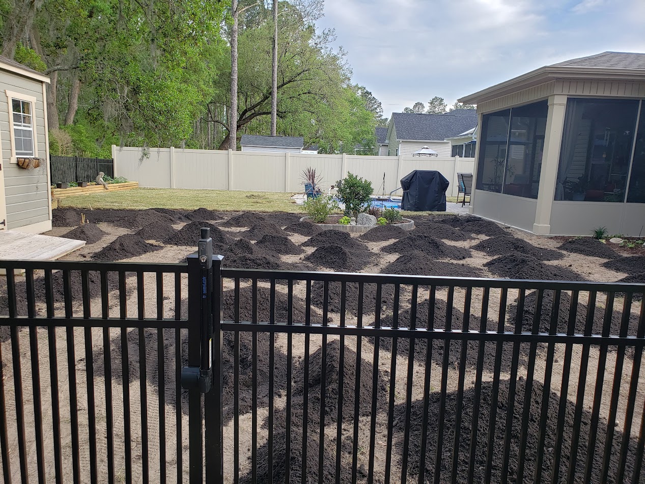 Bare, graded soil before sod installation